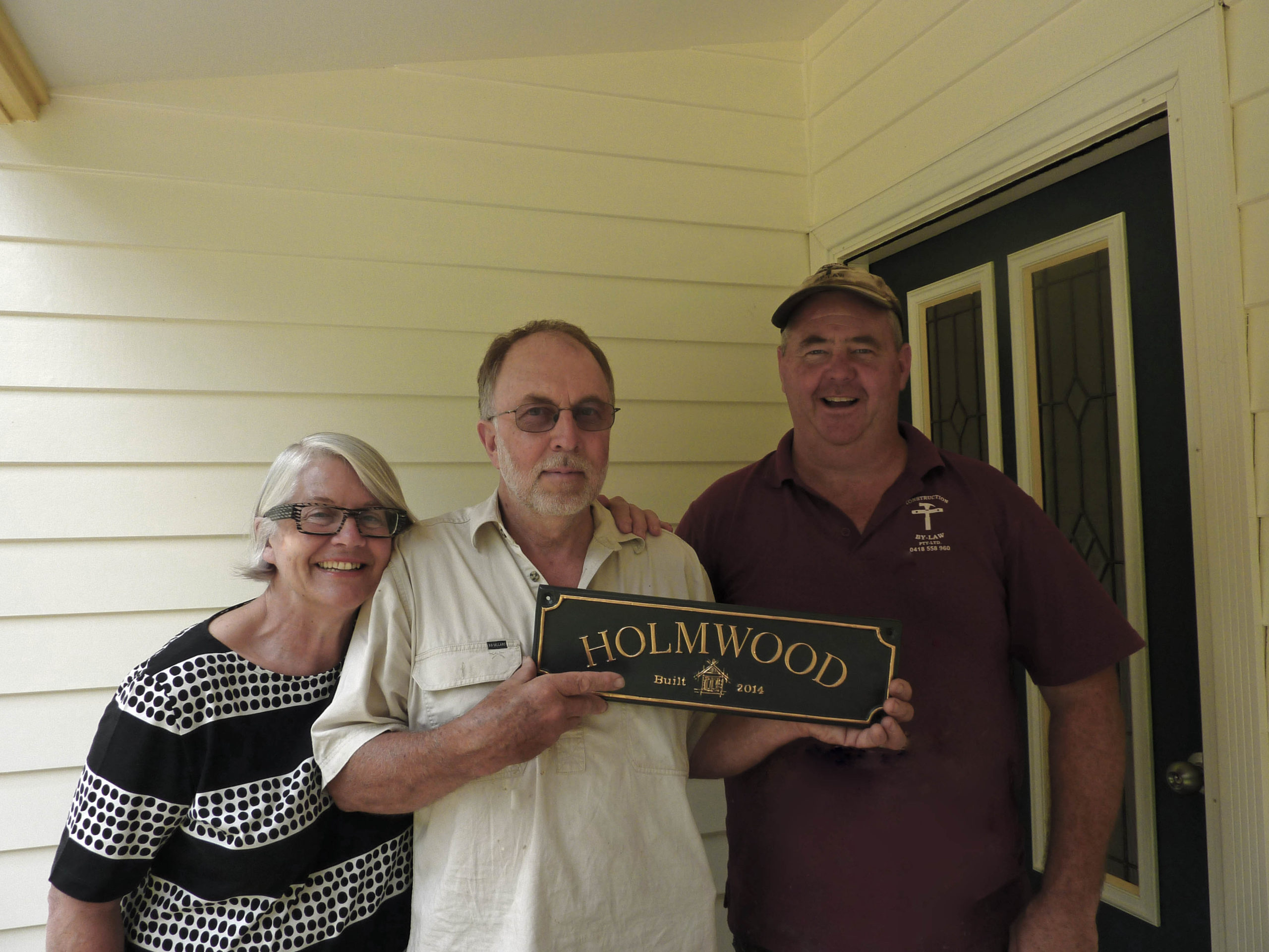 Happy owners Pam and Ewen with Doug the builder